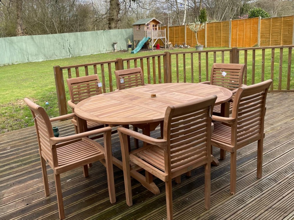 Teak Garden Dining Set. Table 6 chairs cushions and parasol.