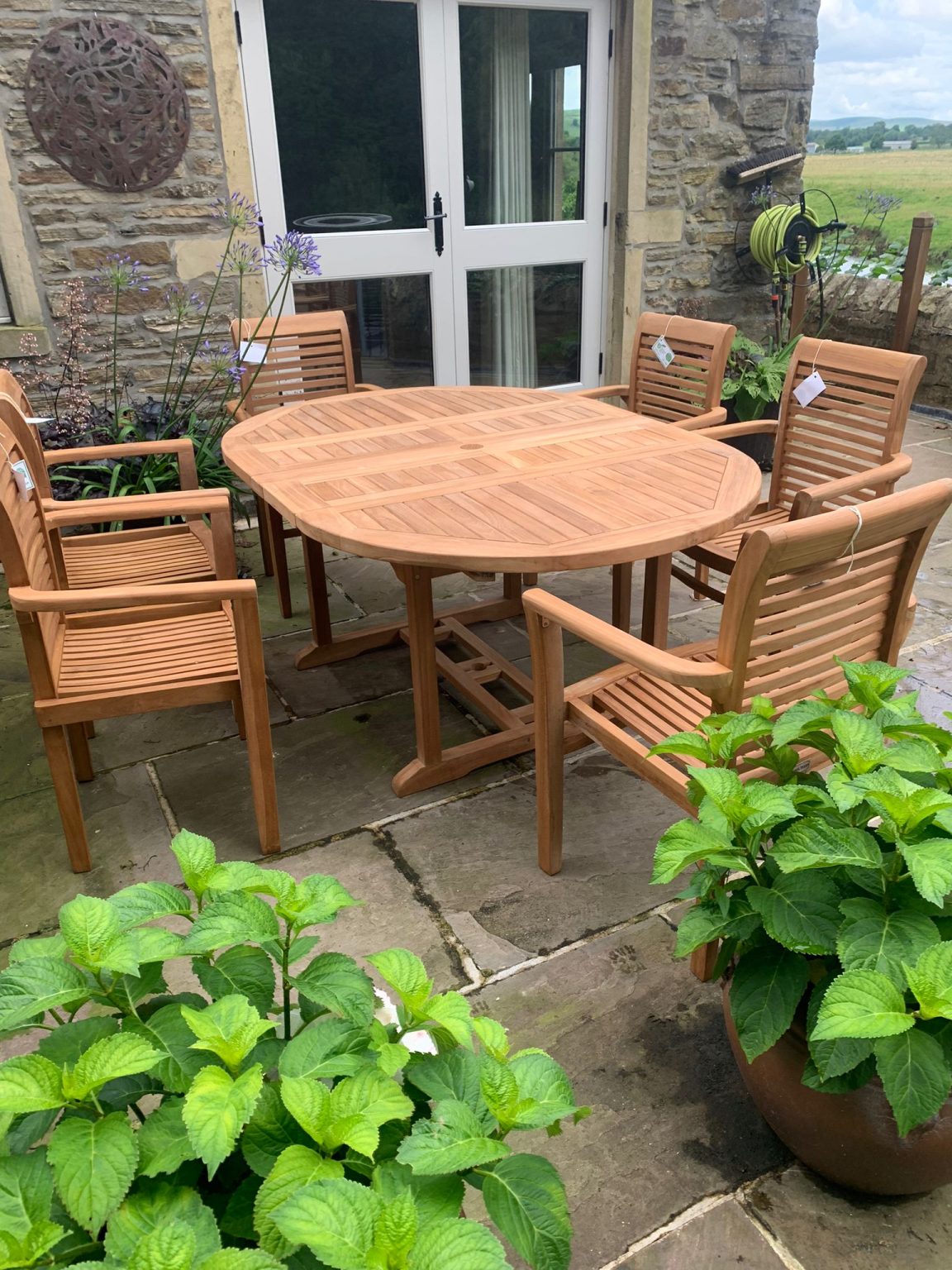 Teak Garden Dining Set. Table 6 chairs cushions and parasol.