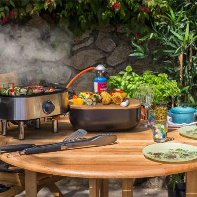 Mini portable gas BBQ, ideal for festivals, camping, picnics and a superb balcony BBQ too. Fully self contained design. BBQ anywhere! From Kingsley Smythe.